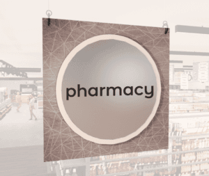 Modern Collection's singled sided large department sign with digitally printed text "pharmacy" centered on a circular overlay