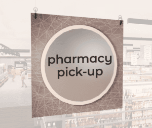Modern Collection's large department sign with digitally printed text "pharmacy pick-up" centered on a circular overlay.