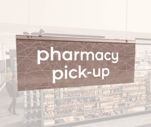 Modern Collection's singled sided small hanging dept sign with digitally printed white dimensional text "pharmacy pick-up."