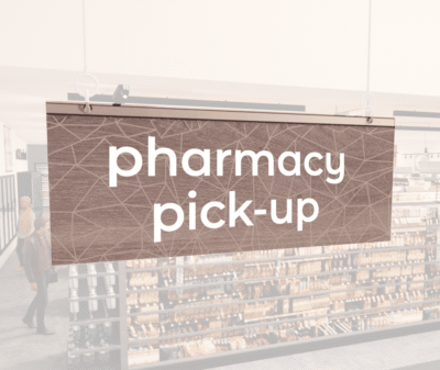 Modern Collection's singled sided small hanging dept sign with digitally printed white dimensional text "pharmacy pick-up."