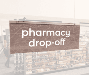 Modern Collection's singled sided small hanging dept sign with digitally printed white dimensional text "pharmacy drop-off."