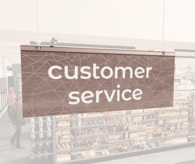 Modern Collection's singled sided small hanging dept sign with digitally printed white dimensional text "customer service."