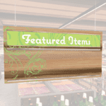 Natural Collection's hanging promotional sign header and inserts or dry erase board on one side and wood grain on the back.