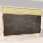 Natural Collection's hanging menu board sign with chalkboard insert. Chalkboard is removable for easy updating & convenience.