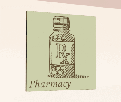 Traditional Collection's wayfinding department sign for the "Pharmacy," that is digitally printed on vinyl-wrapped wood core.