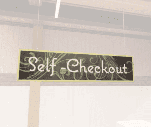 Natural Collection's hanging self-checkout section wayfinding sign that is digitally printed on 6 millimeter PVC.