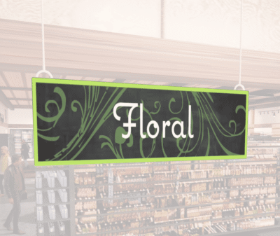 Natural Collection's wayfinding hanging department sign with white text in the center of the signs reads "Floral" on 6 mil PVC