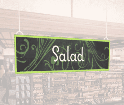 Natural Collection's wayfingding hanging department sign that has "Salad," digitially printed in white text and on PVC.