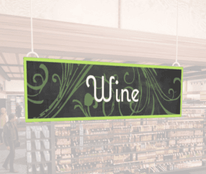 Natural Collection's hanging department sign with text reading "Wine" for Wine or Alcohol Department Wayfinding.