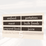 Natural Collection's aisle marker customizable kit of 12 inserts. Text of your chioce is digitally printed on styrene.