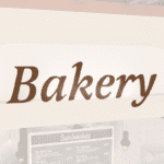 Traditional Collection's department sign for Bakery that is wall mounted with dimensional wood letters with a painted finish