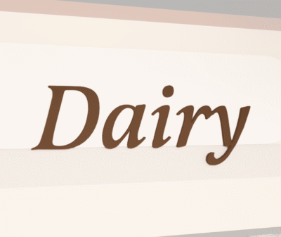 Traditional Collection's sign for the Dairy department that is wall mounted with dimensional wood letters & a painted finish