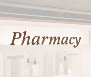 Traditional Collection's wayfinding Pharmacy dept sign that is wall mounted with dimensional wood letters & a painted finish