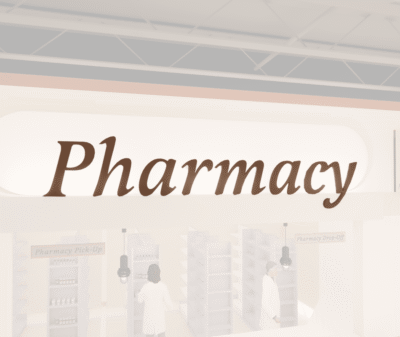 Traditional Collection's wayfinding Pharmacy dept sign that is wall mounted with dimensional wood letters & a painted finish