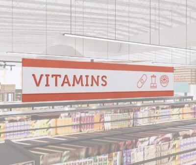 Vitamins section short department sign in the Iconic Collection's cheerful color scheem